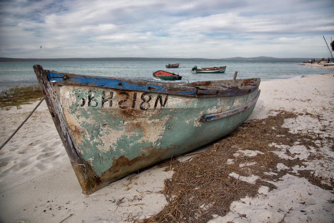 An old wooden fishing boat on the beach at Churchhaven