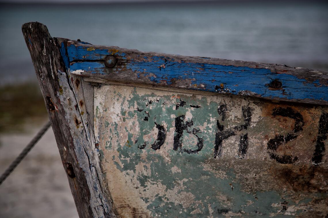 Close-up of a weathered blue fishing boat at Churchhaven